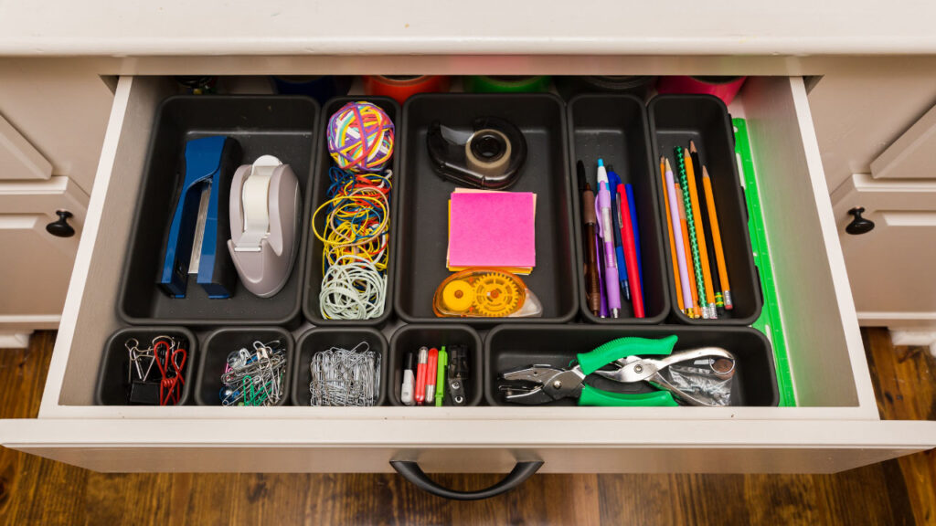 drawer organised with office supplies