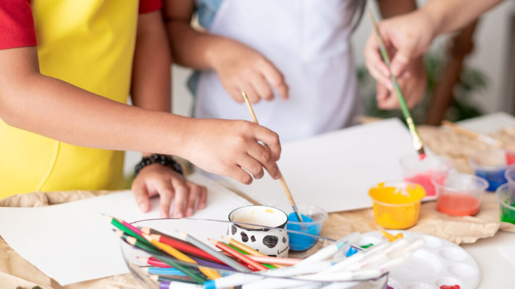 hands painting during an art workshop session